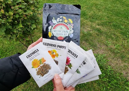 Medicinal Garden Kit individual seed packets showing Calendula officinalis California poppy Eschscholzia californica and Echinacea purpurea seeds with main kit package containing ten non-GMO medicinal plant species selected for documented secondary metabolite chemistry and traditional medicinal use
