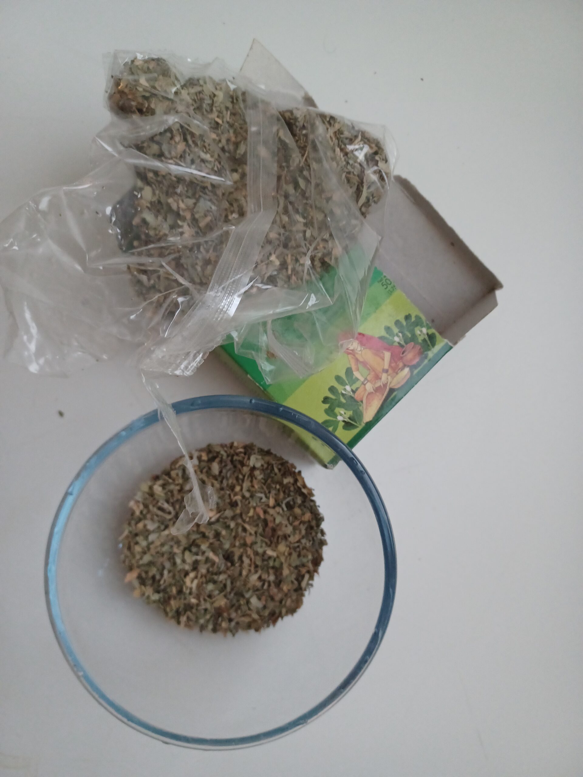 Serge's personal dried Trigonella foenum-graecum fenugreek leaves in glass bowl with packaging showing flavonoid vitamin and mineral rich leaf material distinct from seed tissue where furostanolic saponin and 4-hydroxyisoleucine compounds concentrate for hormonal and blood sugar effects