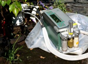 Serge using a Li-Cor gas analyzer and a soil respiration chamber to measure ecosystem health and carbon exchange in the field.