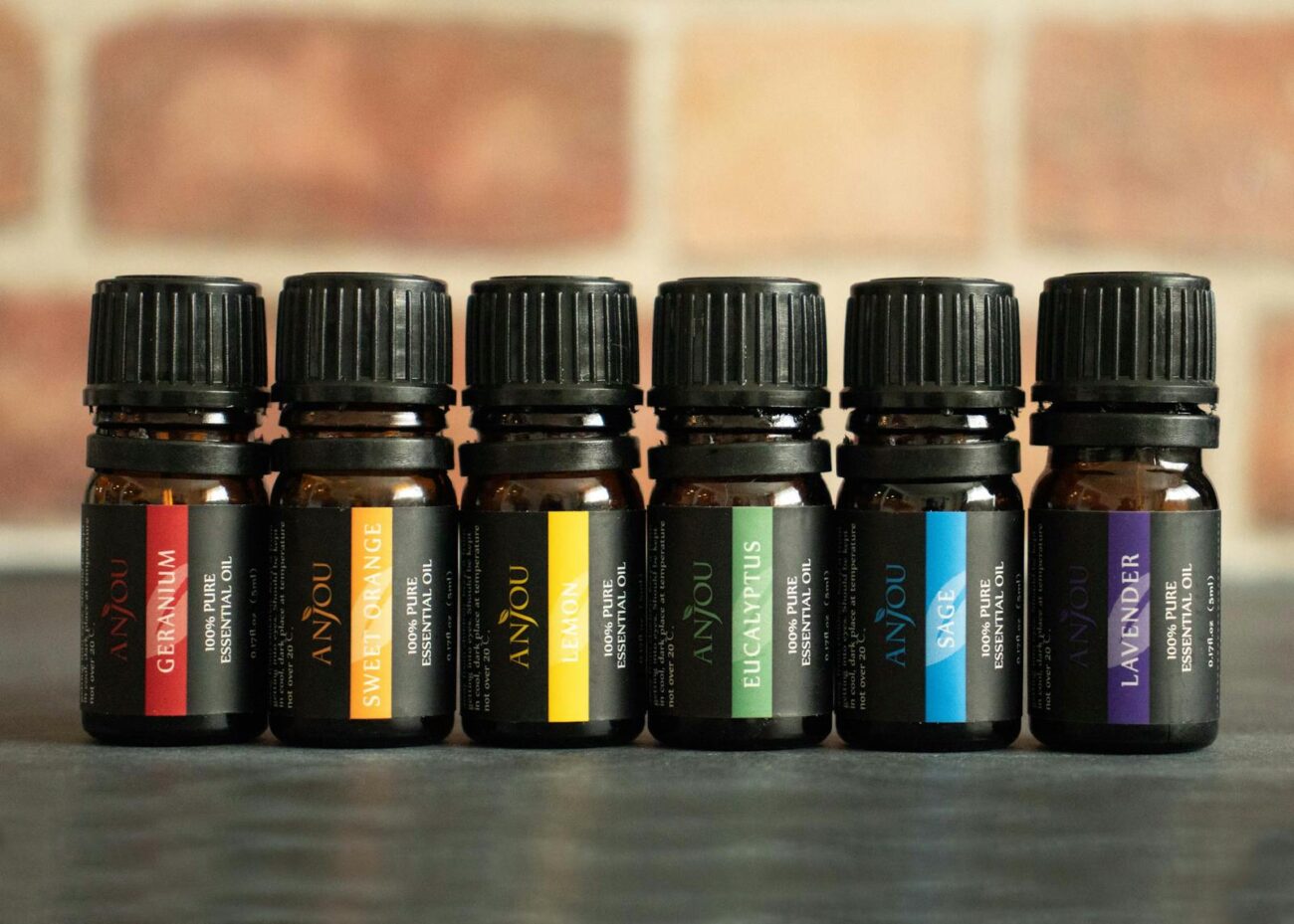 Six pure essential oil bottles including lavender eucalyptus lemon and sage showing concentrated plant volatile compound extracts used in aromatherapy for stress relief and relaxation