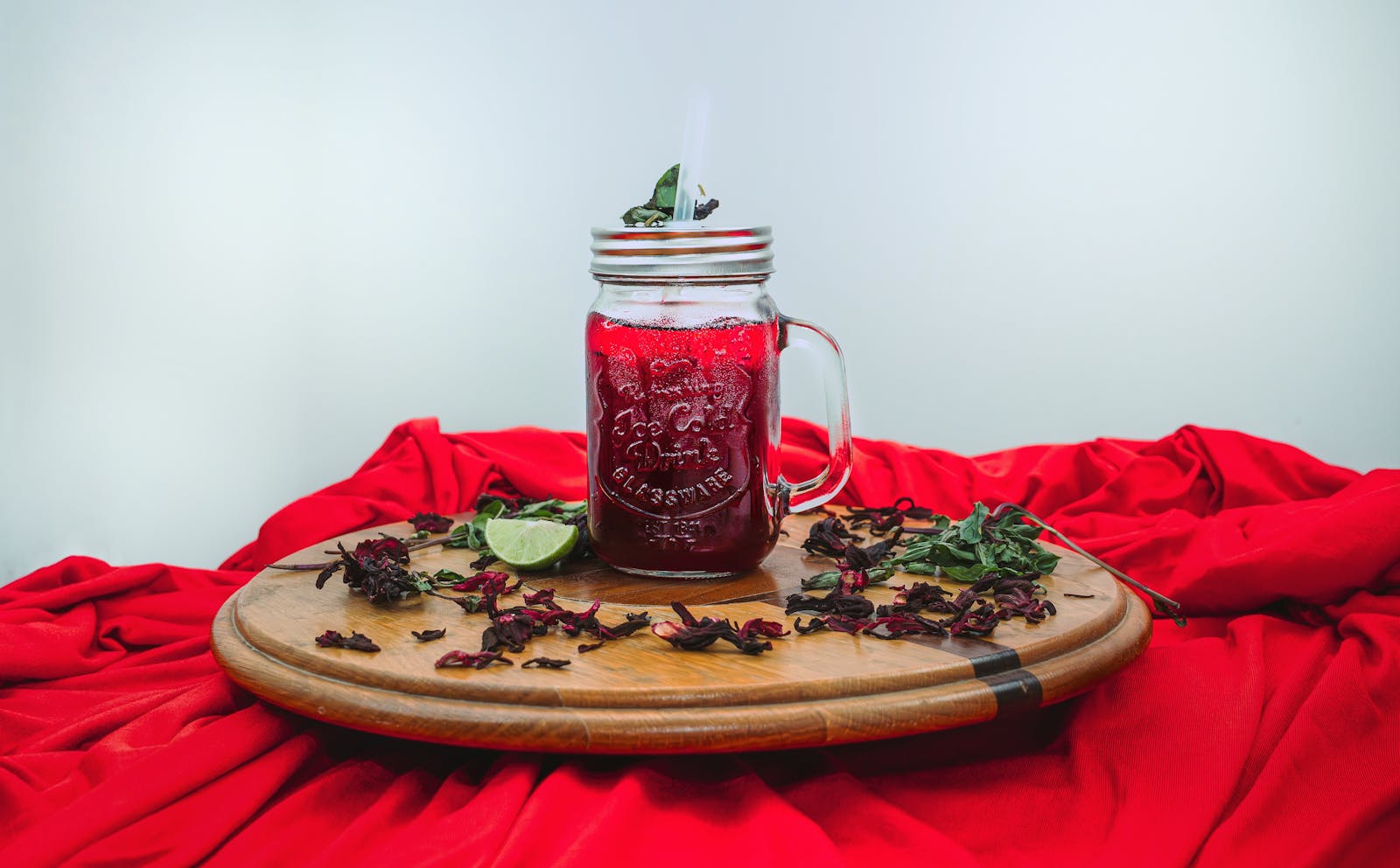 Hibiscus sabdariffa dried red calyces showing high concentration delphinidin and cyanidin anthocyanin secondary metabolites produced through phenylpropanoid pathway with documented ACE inhibition activity and antioxidant properties relevant to blood pressure and exercise recovery