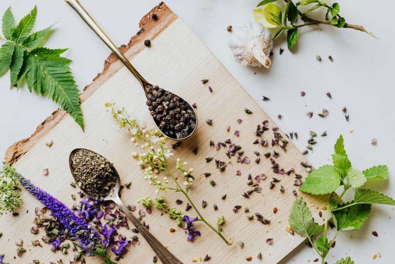 Collection of medicinal plants including ginger chamomile echinacea and turmeric showing diverse secondary metabolite compound classes produced through phenylpropanoid isoprenoid and other biosynthetic pathways with documented biological activity in mammalian systems.
