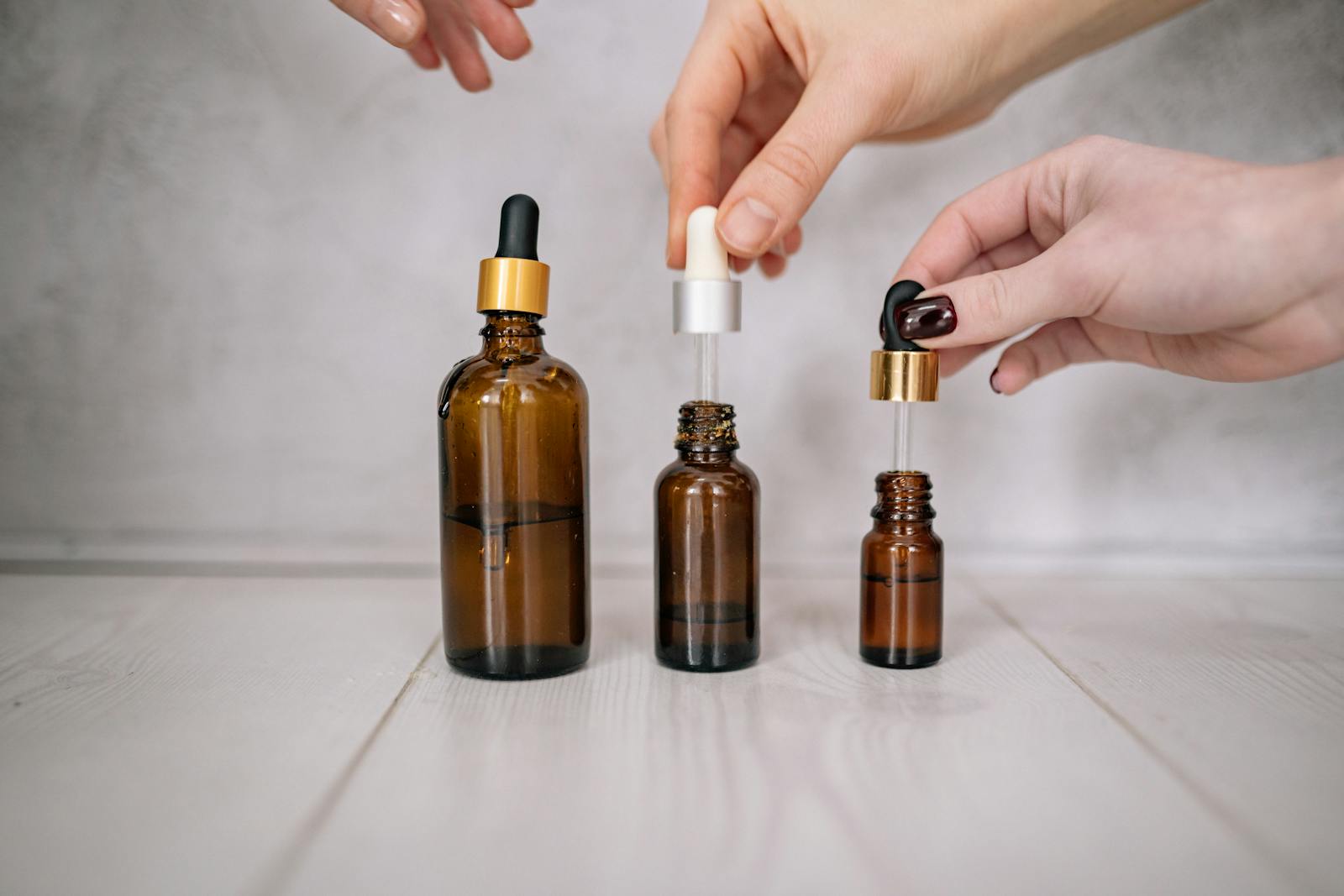 Herbal tincture in dark glass dropper bottle showing ethanol based extraction that dissolves both water soluble and lipophilic plant secondary metabolites unlike water based tea preparation which only efficiently extracts polar compounds