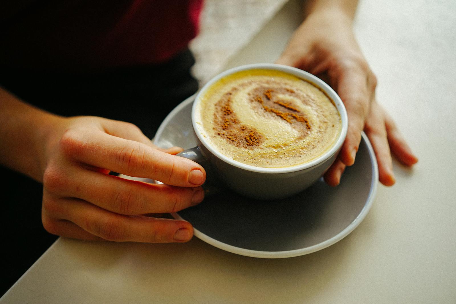 Turmeric golden milk preparation showing traditional fat based delivery of curcumin polyphenol combining turmeric with lipid medium and black pepper improving bioavailability through curcumin dissolution and piperine mediated metabolic inhibition