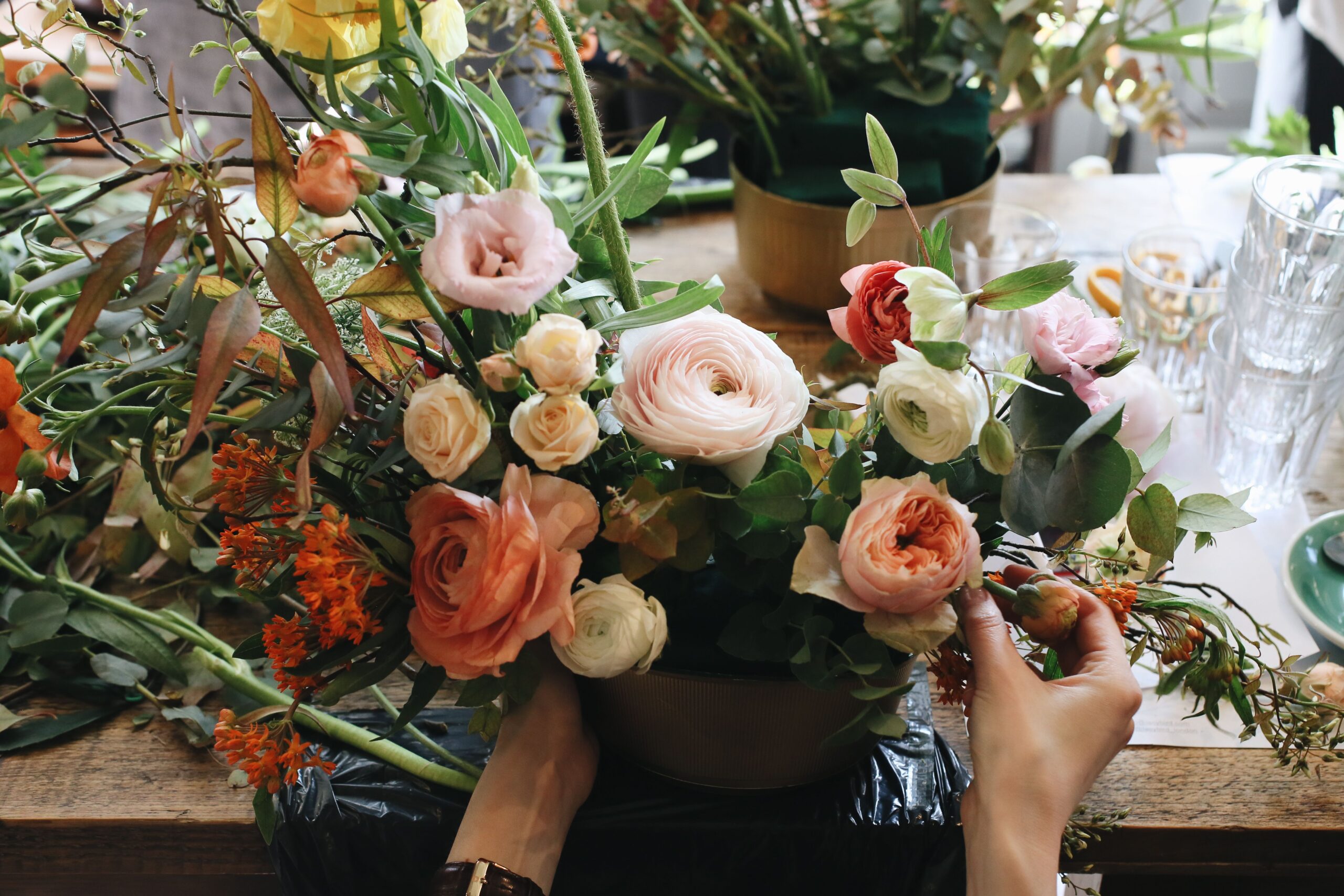 Botanical arrangement featuring fresh flowers and greenery